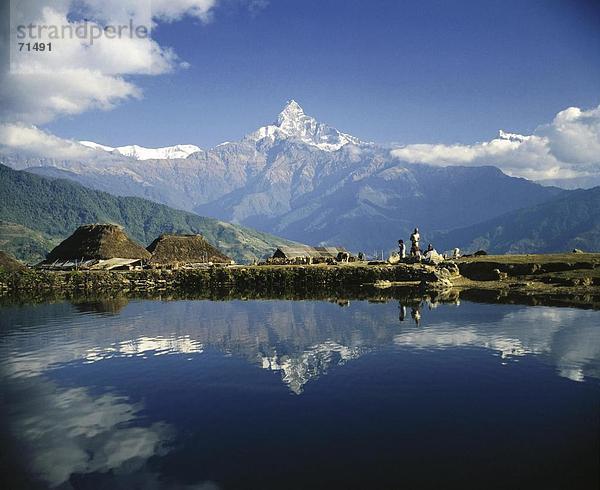 10067603  6999 ms  Annapurna  Himalaya  Menschen  Machapucharé  Nepal  Asien  Panorama  Meer  See  Siedlung