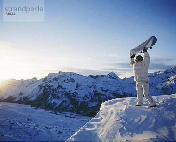 10508878  Board  die Anhebung  Frau  Gipfel  Spitze  Graubünden  Graubünden  Schweiz  Europa  Snowboard  Sonnenuntergang  besondere  Stimmung  dus