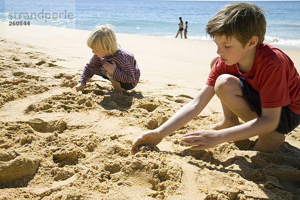 Portugal  Algarve  boys playing on beach