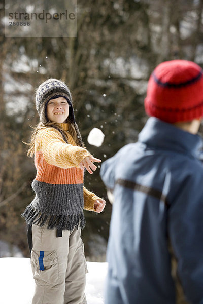 Austria  girl (8-9) throwing snowball