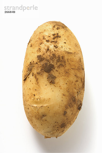Eine Kartoffel mit Erde
