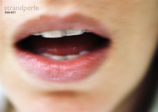 Close up of woman's open mouth  blurry. mouth
