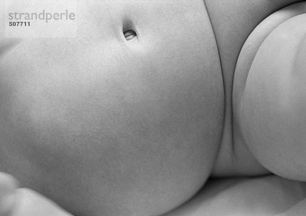 Baby's belly and thigh  close-up  b&w