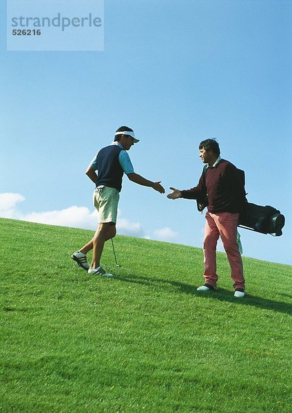 Golfer beim Händeschütteln