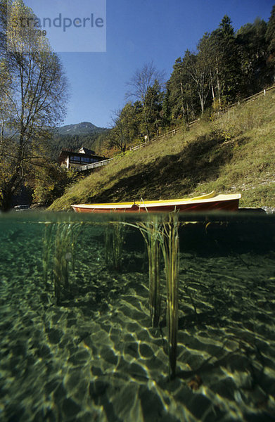 Austria  canoe on mountain lake