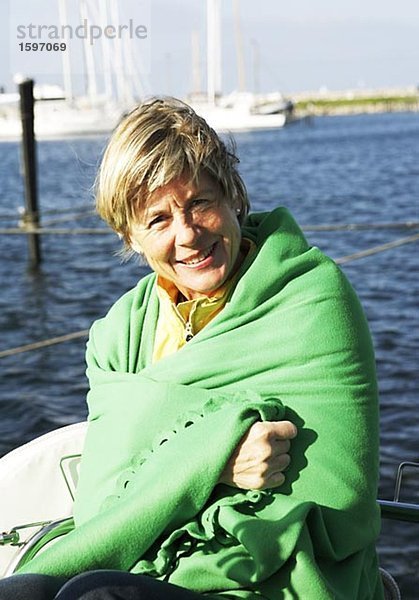 Portrait of a smiling Woman am Meer.