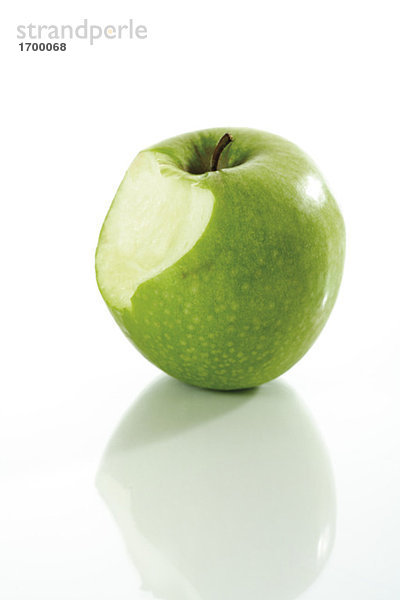 Fresh green apple  bitten inside