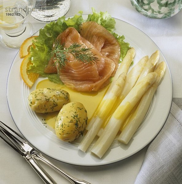 White asparagus with salmon  potatoes and orange sauce
