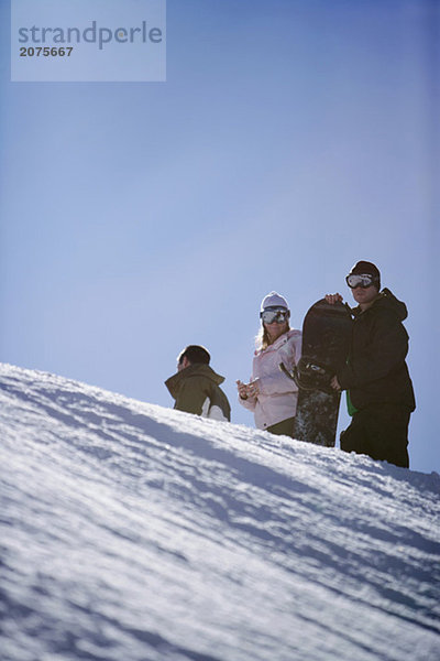 Drei Snowboarder