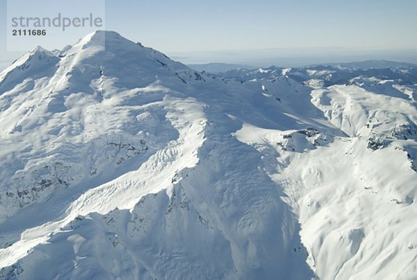 Aerial photo of a dormant snowcapped volcano  Mount Baker  Washington  USA