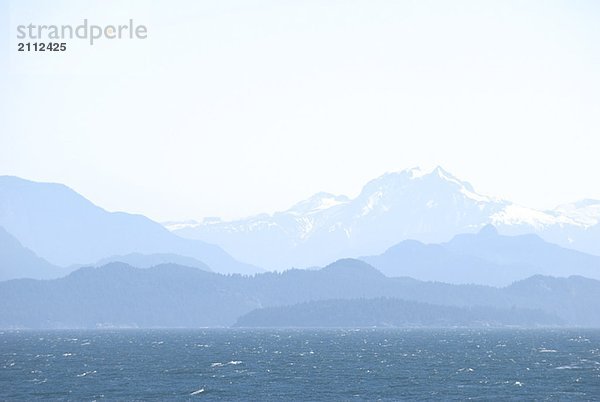 BC's Coast mountains as seen from a BC Ferry in the Strait of Georgia
