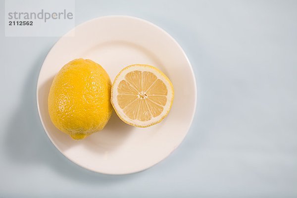 Lemons on white plate