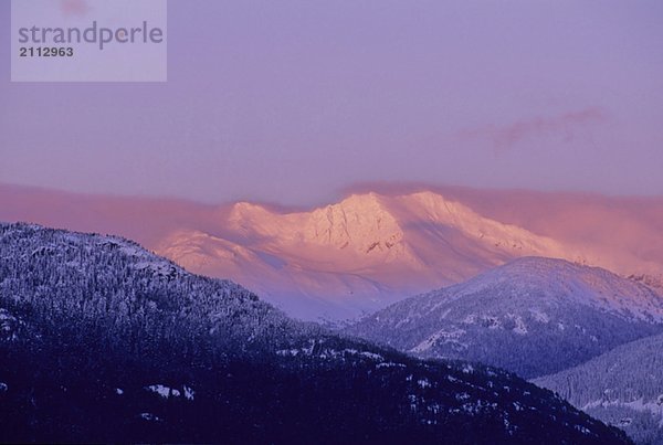 Mt. Currie is lit by pink alpenglow  Whistler  BC Canada