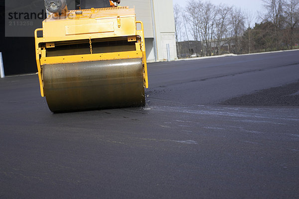 'Steam rollers paving new asphalt