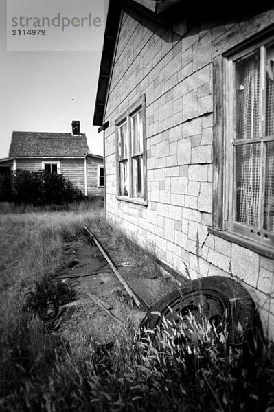 Black and white derelict houses  Robsart  Saskatchewan  Canada