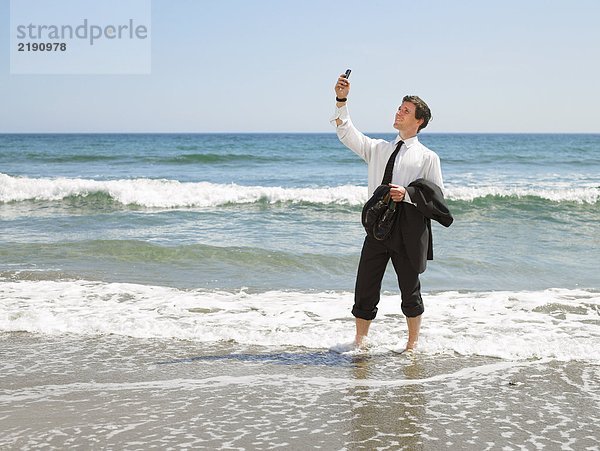 Geschäftsmann am Strand.