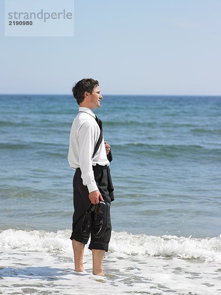 Geschäftsmann am Strand.