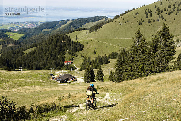 Germany  Bavaria  Chiemsee  Gori Alm  mountainbiker on the way