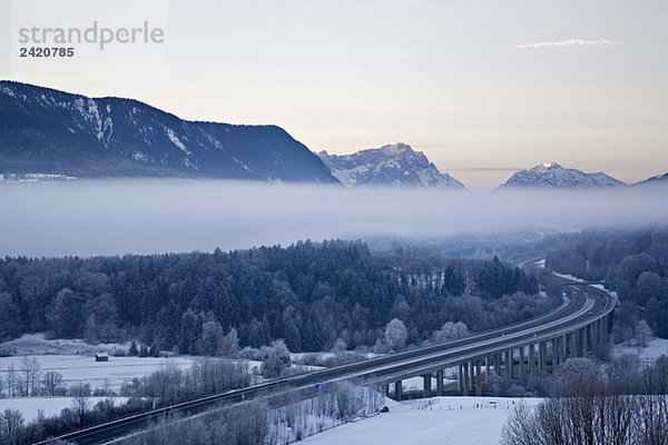 Germany  Bavaria  Highway bridge with mountain landscape
