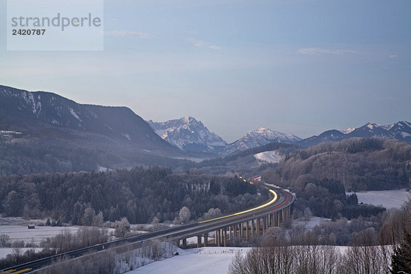 Germany  Bavaria  Highway bridge with mountain landscape