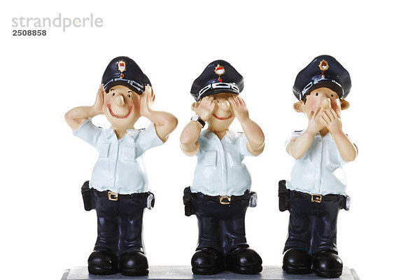 Plastikfiguren von Polizisten  Kein Böses sehen  Kein Böses hören  Kein Böses sprechen