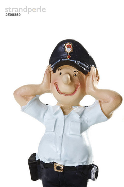 Plastikfigur eines Polizisten  Kein Böses hören  Nahaufnahme