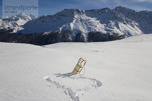 Switzerland  Graubuenden  Savognin  Winter scenery with sledge