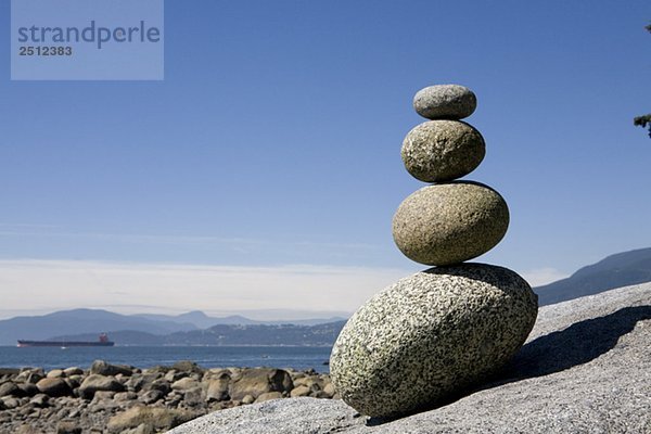 Rocks stacked on beach  English Bay  Vancouver BC