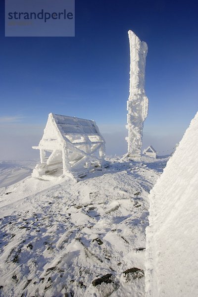 View of snow-covered shelter at top of Mont Logan at sunrise  Quebec  Canada