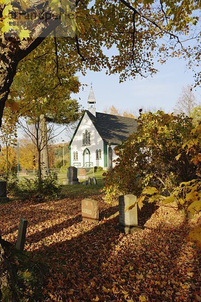View of Holy Trinity Church Iron Hill Anglican in autumn landscape  Eastern Townships  Quebec  Canada.