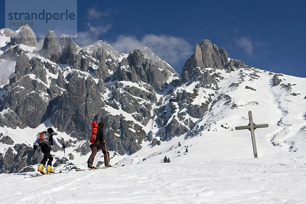 Austria  Salzburger Land  Hochkoenig mountain  Couple on skis hiking