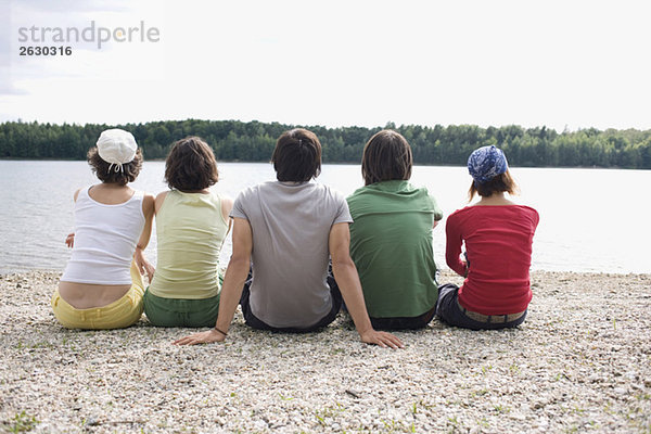 Germany  Leipzig  Ammelshainer See  Five persons stting near lake