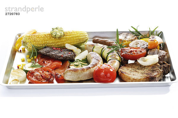 Grilled meat  sausage and vegetables on tray