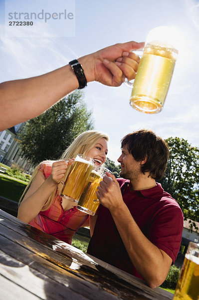 Germany  Bavaria  Upper Bavaria  Young couple in beer garden