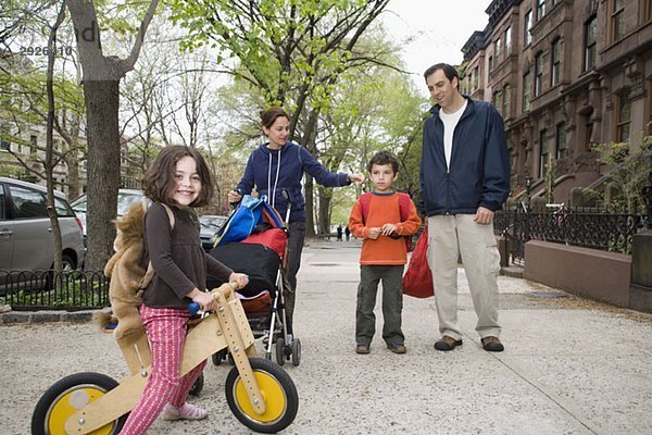 A family on a sidewalk  Brooklyn  New York City
