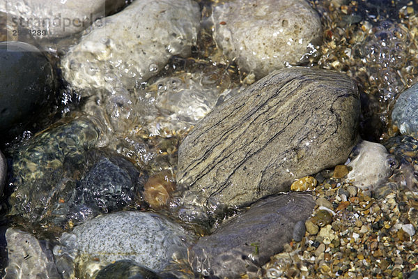 Rocks and pebbles in shallow water  Ontario