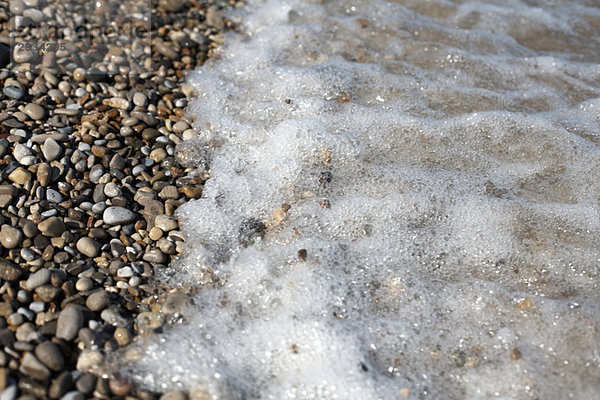 Tide washing over pebbles  Ontario