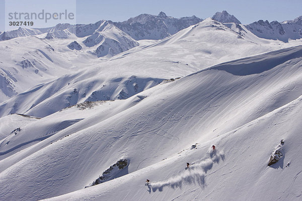 India  Kashmir  Gulmarg  Three persons skiing downhill