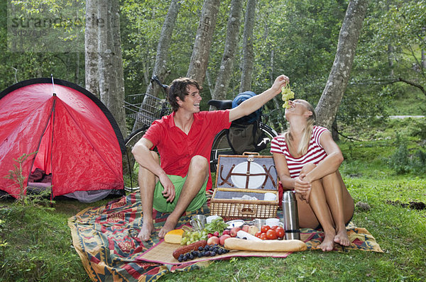 Austria  Salzburger Land  Couple having a picnic