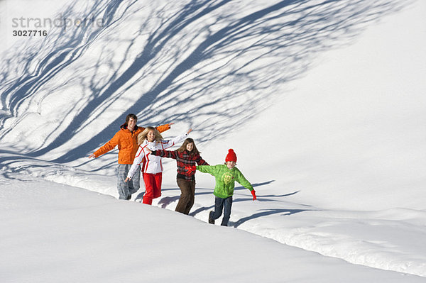 Austria  Salzburger Land  Altenmarkt  Family walking in snow
