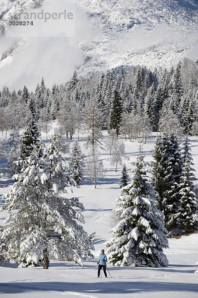 Austria  Tyrol  Seefeld  Wildmoosalm  Woman cross country skiing