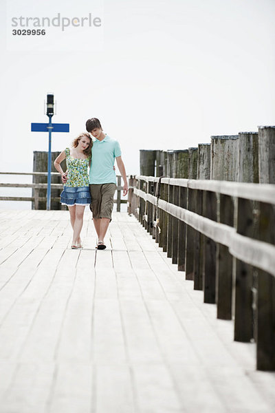 Germany  Bavaria  Ammersee  Couple walking across pier