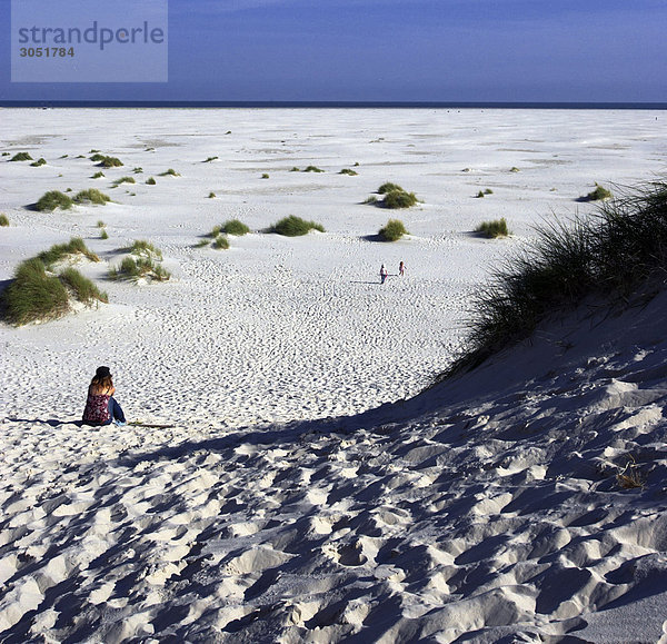 Amrum island  woman sitting on beach
