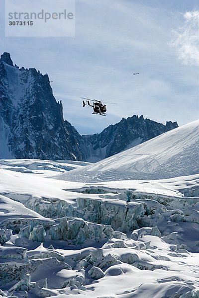 Rescue helicopter in Mer de Glace Chamonix France.