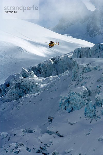 Rescue helicopter in Mer de Glace Chamonix France.