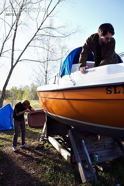 Two men and a sailing-boat Sweden.