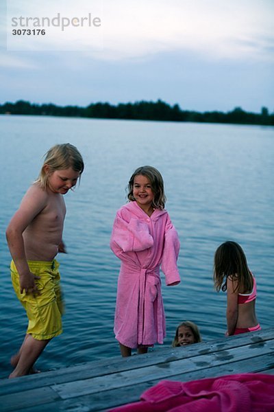 Children by a jetty Sweden.