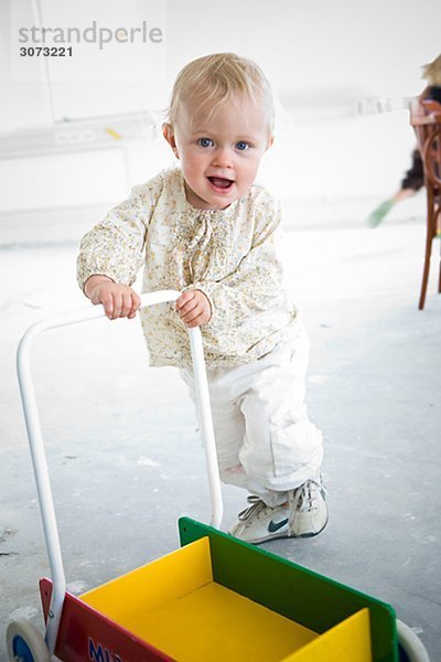 A little girl learning to walk Sweden.