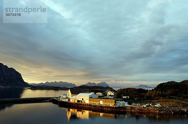 Ocean view and the midnight sun Henningsvaer Lofoten islands Norway.