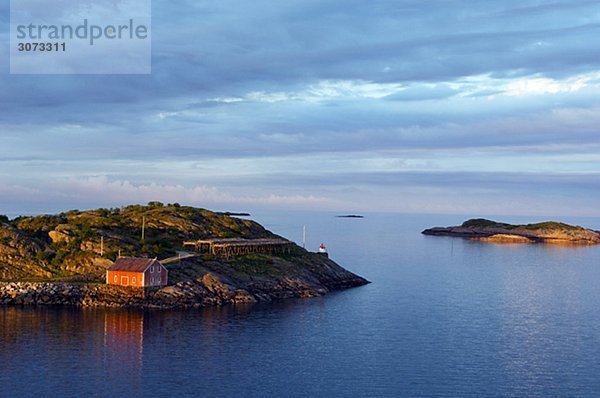 Ocean view and the midnight sun Henningsvaer Lofoten islands Norway.